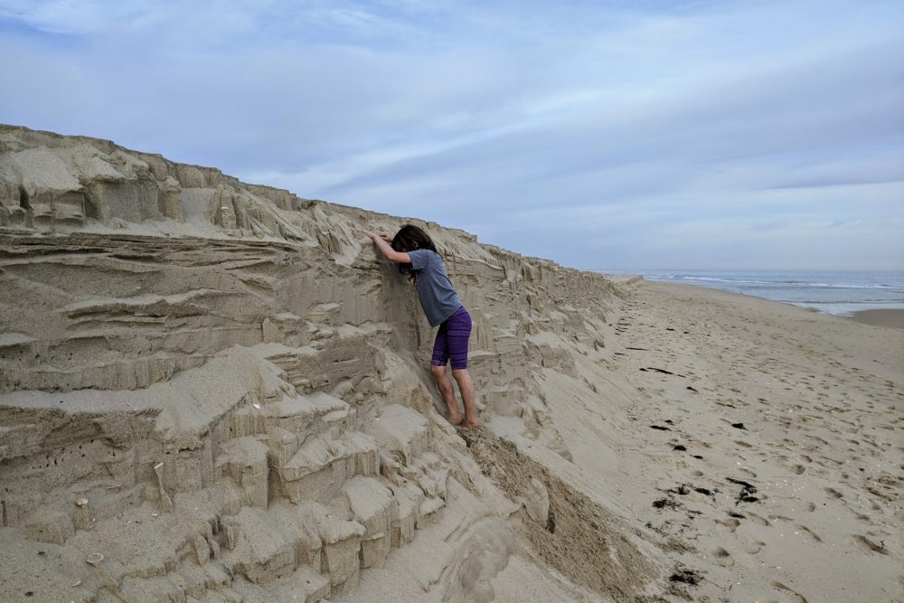 Sophia climbing the sand shelf.